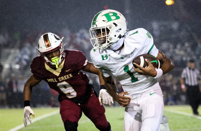 Buford's KJ Bolden runs with a catch as Mill Creek's Kaymon Bolden pursues. 11/13/2023